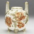Ott  brewer belleek porcelain spherical vase with four feet and two upright handles reticulated with guilded filligree flanking large orange poppies on a white ground red crown mark 8 x 6
