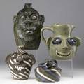 Cleater meaders etc four folk art figural pieces cleater meaders jr face jug 10 12 jerry brown face jug 1990 8 and two charles lisk jugs of marbled clays one with a face 7 the other wit