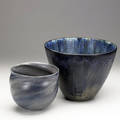 Tove anderberg and etienne von wondergehen two scandinavian glazed ceramic vessels the smaller covered in purple speckled glaze by tove anderberg the larger covered in mottled blue and teal glazes b