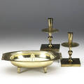 Tommi parzinger threepiece console set including a pair of candlesticks and footed candy dish with glass liner each marked dorlynsilver smiths candlesticks 7 14 x 4 14 sq dish 3 18 x 12