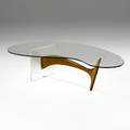 Style of vladimir kagan coffee table with biomorphic glass top over sculpted walnut and lucite base 16 34 x 65 x 36