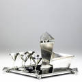 Elsa tennhardt  e  j bass company new york nine piece cocktail set in silverplated brass including six glasses shaker ice bucket and tray ca 1928 similar example in the collection of the