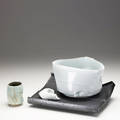 Chris staley threepiece sculpture fired ice and bowl on black tray of pale blue glazed porcelain elements on gunmetal base together with glazed porcelain cup 1993 sculpture signed staley 1993