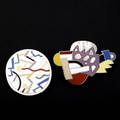 Ettore sottsass  acme studios two brooches from the memphis designers for acme series optima and circulus 198586 this pair comes with an original acme studio felt jewelry case an example of