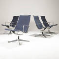 Charles and ray eames  herman miller four aluminum group lounge chairs upholstered in light blue wool upholstery on aluminum frames embossed signature 34 12 x 24 12 x 28 12
