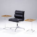 Charles eames  george nelson  herman miller soft pad side chair upholstered in black leather and a pair of adjustableheight tray tables by george nelson chair has embossed eames mark chair 34 x