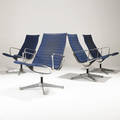 Charles and ray eames  herman miller four aluminum group lounge chairs upholstered in navy blue wool upholstery on aluminum frames embossed signature 34 12 x 24 12 x 28 12
