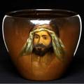 Weller louwelsa 11 jardiniere painted by levi burgess with a middle eastern gentleman artist signed and stamped louwelsa weller