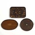 Serving trays grouping of three include oval handled with shell inlay round with brass inlay and rectangular papier mache some damage all 19th c largest 26 x 19 12