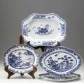Chinese export grouping of four blue and white pieces includes pair of oval platters scalloped bowl and rectangular platter with restoration largest 10 12 x 14 12