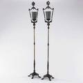 Decorative lighting pair of wroughtiron torcheres with grasshopper design on glass shades electrified early 20th c ht 79