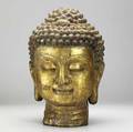 Cast iron buddha southeastern asian origin with gilded highlights 19th20th c 17