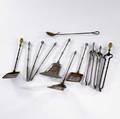 Fireplace tools eleven assorted pieces include shovels tongs and pokers 19th c