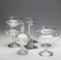Assorted glassware eight pieces comprised of five fruit bowls pair of candlesticks and covered compote all 19th c tallest 10 12