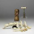 Bone or ivory grouping seven pieces include carved head chinese boat elephant grouping corkscrew with bone handle damages and three sauce ladles largest 16 12