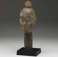 Ibo head crest nigeria serene ancestral image carved from honeycolored wood with classic forehead scarification and stylized coiffure early 20th c unusual abstract design adorns the back of the h