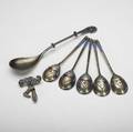 Russian  european enameled silver five small spoons and a larger spoon with twist handle together with a brooch with two suspended shoe charms 19th20th c all in asis condition larger spoon 8