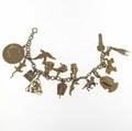 Gold charm bracelet fifteen charms in 12k 14k or 18k yg 37 gs gw