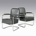 Style of warren mcarthur pair of tubular metal armchairs upholstered in green vinyl on cantilevered bases 32 14 x 24 14 x 24