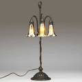 tiffany studios threelight lily table lamp with gold favrile shades on an adjustable floriform bronze base with verdigris patina from a local estate we believe this piece to be in mint original c