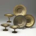 tiffany studios six giltbronze items in assorted patterns three compotes and three plates dent to one plate some unevenness to patina on tallest compote each stamped tiffany studios new york nu