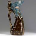 emile galle aesthetic movement ceramic pitcher with avian handle and enameled decoration of fantastical insect flying over weeds c 1870 several minor glaze flecks stamped eg with cross of lorrain