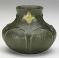 grueby squat vase with tooled and applied leaves alternating with bright yellow daffodils on a rich matte green ground grueby pottery medallion stamp er 1221 4 12 x 5 12