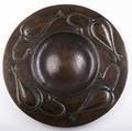 Gustav stickley fine and large hammered copper circular wall plaque no 345 embossed with stylized pods around an open center enhanced patina circular als ik kan mark 19 34 dia