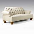 Juan montoya sofa upholstered in tan linen with tufted backrest on turned wooden feet provenance juan montoya collection 38 x 88 x 34