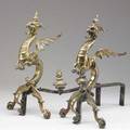 Decorative pair of brass andirons the uprights of ornate gilded dragon form 20 x 14 x 19