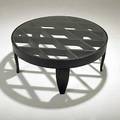 After gio ponti ebonized wood coffee table with inset plate glass top unmarked 16 12 x 41 14 dia