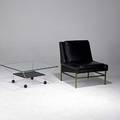 Modern lounge chair on brass base together with chrome steel coffee table with plate glass top 32 x 28 x 28