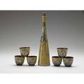Pillin sake set stoppered sake bottle decorated with a horse and six matching cups hairline to neck of bottle signed bottle 12