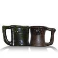 George ohr two puzzle mugs one with rabbit handle green one mishapen one with script signature the other stamped each 3 34 x 5