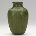 Grueby vase with layered leaves matte green glaze one inch bruise to rim grueby faience stamp 100 illegible artist cipher 8 12 x 5 34