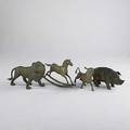 Animal sculpture four brass pieces include a lion bull pig bank and rocking horse 20th c largest 19 12 x 28 x 5 12