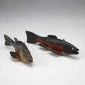 Two fish decoys carved and painted with tin fins 20th c longest 9