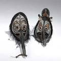 Two new guinea basketry masks adorned with cassoway feathers with natural pigments larger 37