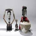 Four african objects ibo headdress with articulated arms and breast attachments nigerian janus mask with articulated arms smaller wood figure and zebra skin drum largest 41