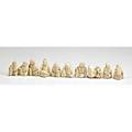 Netsuke grouping ten in bone or ivory all of seated male figures tallest 1 12