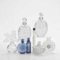 Lalique eight perfume bottles figural stopper clairefontaine lotus form two lilacs for worth dahlia magic of lancome and two cobalt blue all 20th c tallest 5 14