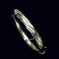 Gold bangle twisted top hinged in 14k yg 20th c 20 gs 7 interior dia