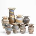 Niloak missionware grouping eight baluster vases some impressed niloak some paper labels tallest 8