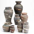 Niloak missionware grouping eight baluster vases most impressed niloak one paper label tallest 10
