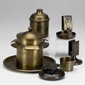 Roycroft smoking items four match holders eight ashtrays one covered two 4piece ashtray sets one with glass liner cigarette box pipe rack and brass tray with five cups most hammered copper