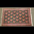 Oriental rug all over rose design on dark blue ground 109 x 70 12