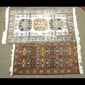 Oriental area rugs one with white ground and blue borders the other in saffron and blue larger 89 x 54
