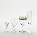Crystal and blown glass stemware fortyseven pieces include twenty decorated with gold leaf four french green stemmed wine glasses six baccarat glasses etc tallest 8