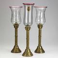 Three brass candlesticks baluster form pushup with cut glass shades one shade with handpainted portrait of a soldier tallest 21 12