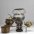 Brass and copper grouping seven pieces include samovar and teapot dresser type teapot hammered copper lamp water carrier middle eastern teapot and lantern tallest 20